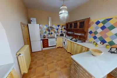 Una cocina o zona de cocina en Casa con encanto, gran capacidad alojamiento-24 personas