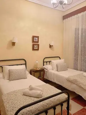 Cama o camas de una habitación en La Casa de Manolita