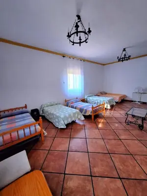 Cama o camas de una habitación en La Cabaña de la Cigarra
