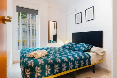 Cama o camas de una habitación en San Pagés 3BR Apartment