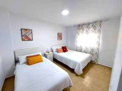Cama o camas de una habitación en Paraná Center Apartment