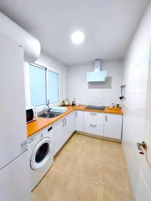 Una cocina o zona de cocina en Paraná Center Apartment