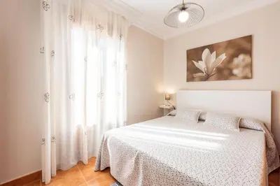 Cama o camas de una habitación en CASA ANGELITA Caminito del Rey, Apartamento con cocina en el centro de Andalucía