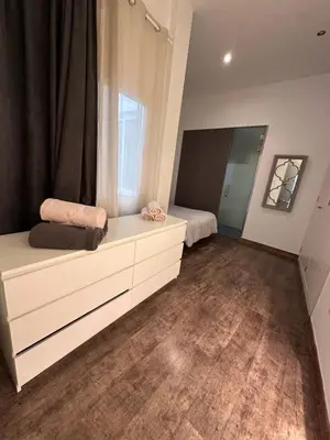 Cama o camas de una habitación en Plaza de los Curtidores sevilla