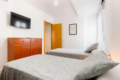 Cama o camas de una habitación en Apto céntrico, 2 aparcamientos privados, bicis