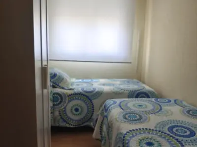 Cama o camas de una habitación en EN CÁ TITO. Luminoso y céntrico. Sevilla auténtica