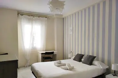 Cama o camas de una habitación en Casa Torrijiano.Parking Gratis!.