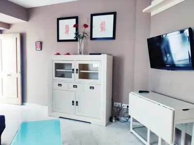 Una televisión o centro de entretenimiento en Casa Torrijiano.Parking Gratis!.