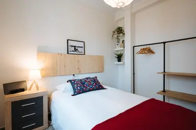 Cama o camas de una habitación en Muro de los Navarros Suite Apartment