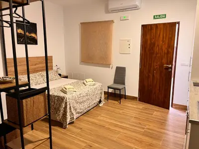 Cama o camas de una habitación en Apartamentos El PELIGRO 3 LA CUEVA