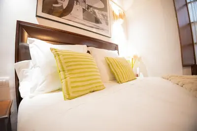 Cama o camas de una habitación en MALAVER SUITE