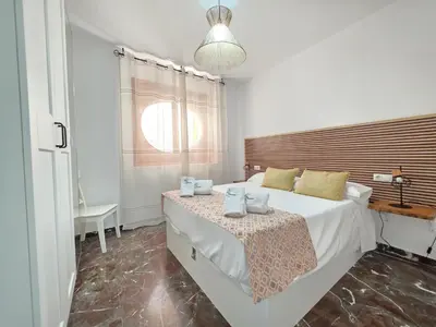 Cama o camas de una habitación en El Sagrario Apartamento céntrico con opción de parking junto a la Catedral