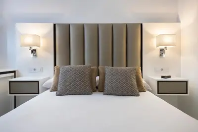 Cama o camas de una habitación en Unika Homes Faustino & Terrace