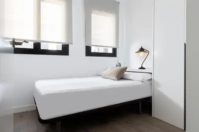 Cama o camas de una habitación en Unika Homes Faustino & Terrace