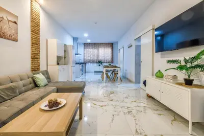 Una televisión o centro de entretenimiento en Living Cordoba Apartamentos
