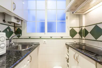 Una cocina o zona de cocina en Peral Home Cozy Apartment