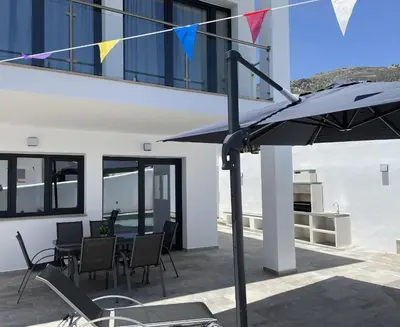 Un balcón o terraza de Villa La Fuente