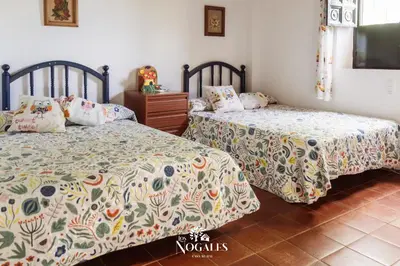 Cama o camas de una habitación en Los Nogales Casa Rural