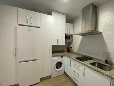 Una cocina o zona de cocina en Apartamento Andalucía Centro II