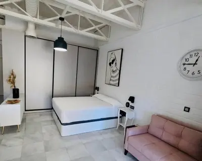 Cama o camas de una habitación en Loft Puerta de Capitulares