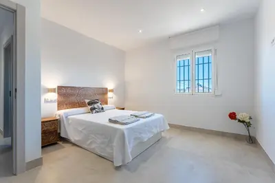 Cama o camas de una habitación en MalagaSuite Villa Nomada El Torcal