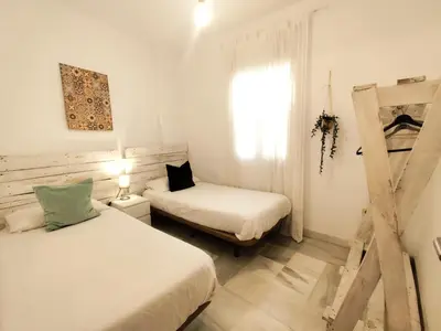 Cama o camas de una habitación en APARTAMENTO SAN LUIS. Plaza de Parking Gratis!!!