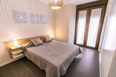 Cama o camas de una habitación en Pilar8 - Apartamento céntrico y moderno con piscina y parking