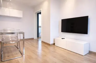 Una televisión o centro de entretenimiento en CENTRICO Y ACOGEDOR APARTAMENTO CORDOBA