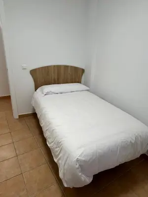 Cama o camas de una habitación en APARTAMENTOS JUAN RAMÓN JIMÉNEZ 3