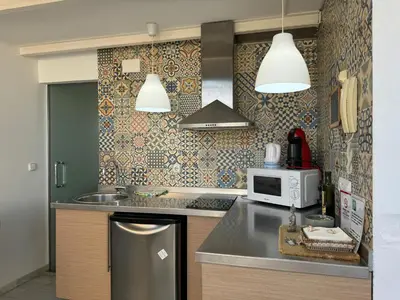 Una cocina o zona de cocina en Ático de la Sultana con terraza privada