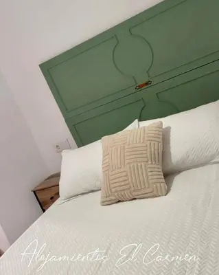Cama o camas de una habitación en Alojamientos El Carmen