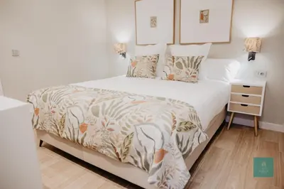 Cama o camas de una habitación en PATIO DE LA MURALLA APARTAMENTOS