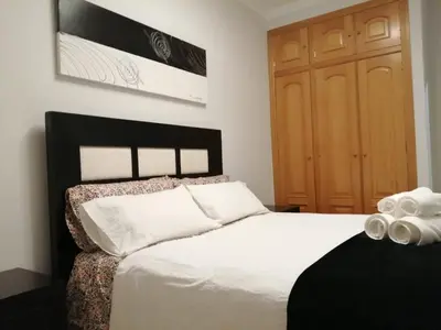 Cama o camas de una habitación en Apartamento La Muralla II