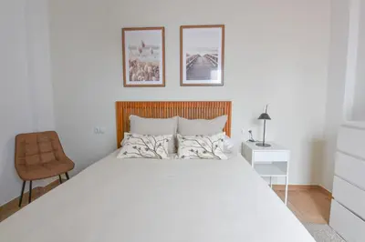 Cama o camas de una habitación en AROMA APARTAMENTO OLVERA