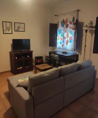 Una televisión o centro de entretenimiento en Apartamento rural Dúplex del monte