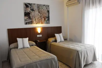 Cama o camas de una habitación en Hostal Restaurante El Cruce