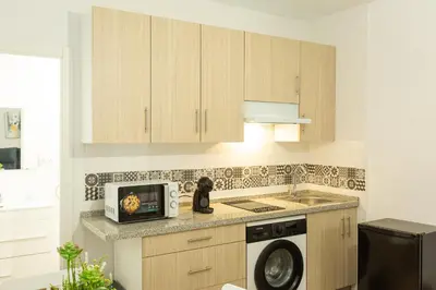 Una cocina o zona de cocina en WISH SUITE AMPARO DE SEVILLA