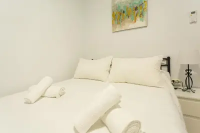 Cama o camas de una habitación en WISH SUITE AMPARO DE SEVILLA