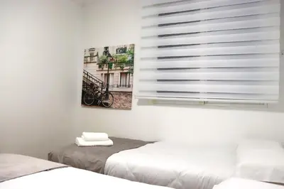 Cama o camas de una habitación en NightInSevilla Juglar Free parking