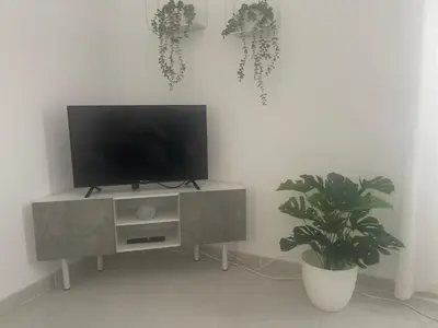 Una televisión o centro de entretenimiento en Apartamento Mirador Castillo Belmez