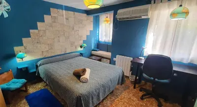 Cama o camas de una habitación en Apartamento El Mundo como Destino - cerca Estadio Cartuja