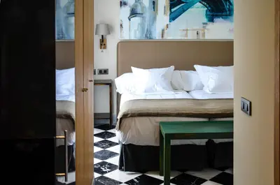 Cama o camas de una habitación en Aguilas5 SevillaSuites
