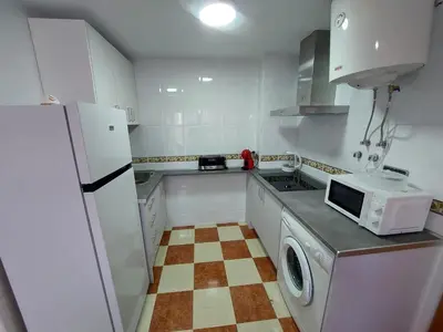 Una cocina o zona de cocina en PLAZA DEL AYUNTAMIENTO con PARKING B&A