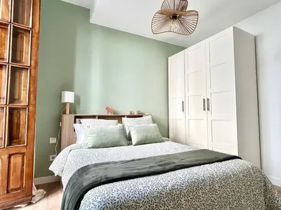 Cama o camas de una habitación en Hispalis Columnas de la Alameda