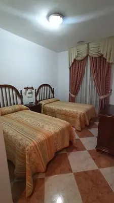 Cama o camas de una habitación en Hostal Algaidas