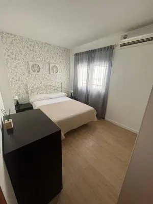 Cama o camas de una habitación en Apartamentos Rincón del Roldán - La Rinconada