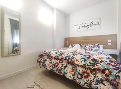 Cama o camas de una habitación en Apartamentos Rincón del Roldán - La Rinconada
