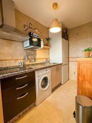 Una cocina o zona de cocina en Duplex Fuente Piedra Escrita