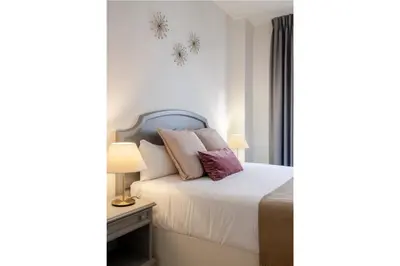 Cama o camas de una habitación en Magno Apartments Santa Justa