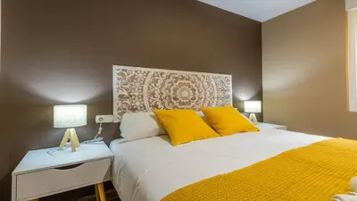 Cama o camas de una habitación en Apartamento Sueños del Guadalquivir Centro Cordoba
